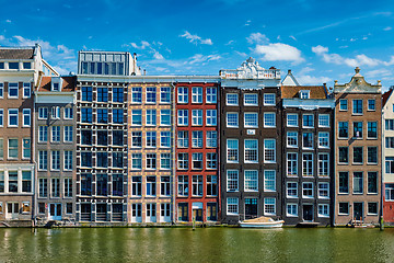 Image showing  houses and boat on Amsterdam canal  Damrak with reflection. Ams