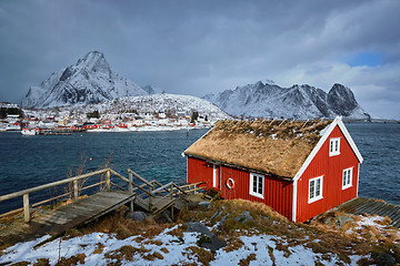 Image showing Traditional red rorbu house in Reine village on Lofoten Islands,