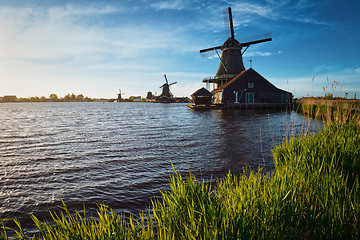 Image showing Windmills at Zaanse Schans in Holland on sunset. Zaandam, Nether