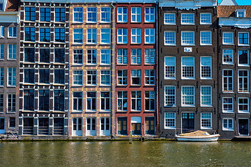 Image showing  houses and boat on Amsterdam canal  Damrak with reflection. Ams