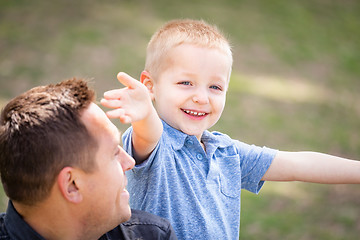 Image showing Young Caucasian Father and Son Having Fun At The Park