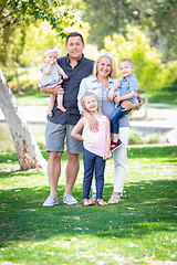 Image showing Happy Young Caucasian Family Portrait In The Park