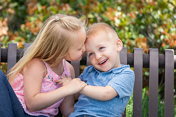 Image showing Young Sister and Brother Having Fun On The Bench At The Park