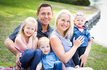 Image showing Happy Young Caucasian Family Portrait In The Park