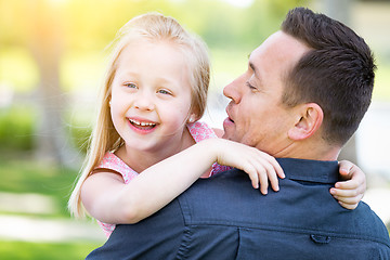 Image showing Young Caucasian Father and Daughter Having Fun At The Park