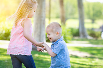 Image showing Young Brother and Sister Playing At The Park Togther