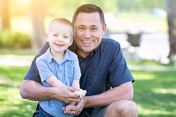 Image showing Young Caucasian Father and Son Having Fun At The Park