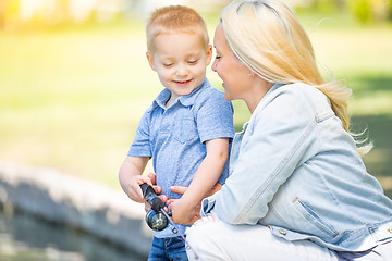 Image showing Young Caucasian Mother and Son Having Fun Fishing At The Lake