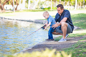 Image showing Young Caucasian Father and Son Having Fun Fishing At The Lake