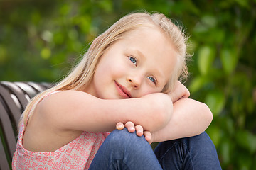 Image showing Pretty Young Caucasian Girl Portrait Sitting On The Bench At The