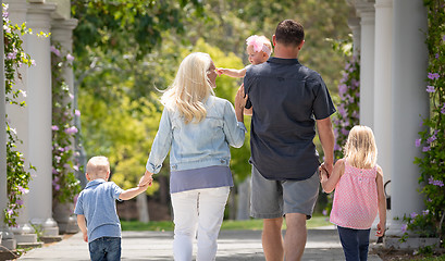 Image showing Young Caucasian Family Taking A Walk In The Park