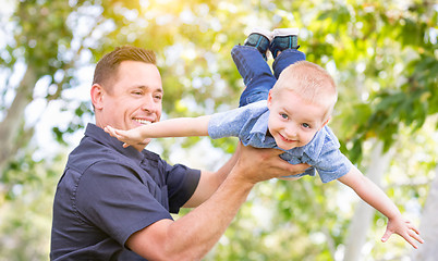 Image showing Young Caucasian Father and Son Having Fun At The Park