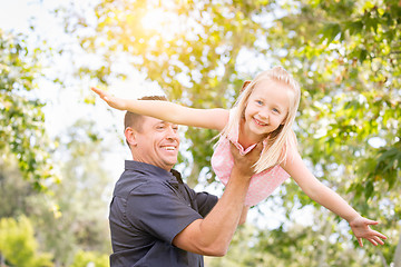 Image showing Young Caucasian Father and Daughter Having Fun At The Park