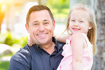 Image showing Young Caucasian Father and Daughter Having Fun At The Park