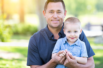 Image showing Young Caucasian Father and Son Having Fun At The Park