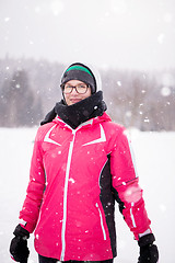 Image showing Portrait of young woman on snowy winter day