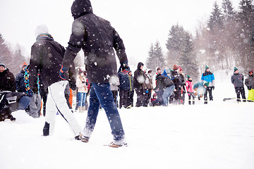 Image showing group of young people having a running in bag competition