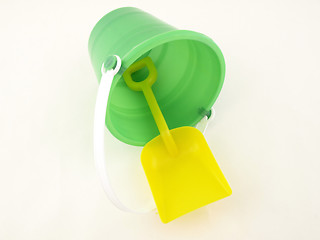 Image showing Plastic bucket and shovel laying on its side