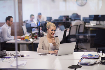 Image showing businesswoman using a laptop in startup office