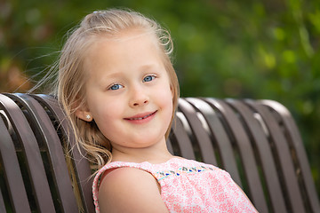 Image showing Pretty Young Caucasian Girl Portrait Sitting On The Bench At The