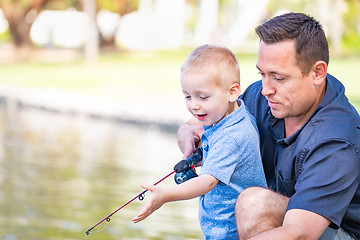 Image showing Young Caucasian Father and Son Having Fun Fishing At The Lake