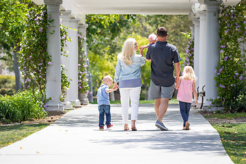 Image showing Young Caucasian Family Taking A Walk In The Park