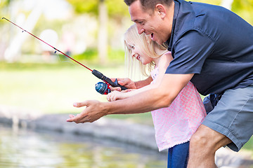 Image showing Young Caucasian Father and Daughter Having Fun Fishing At The La