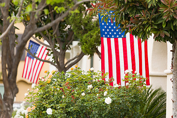 Image showing Front Porches with American Flags.