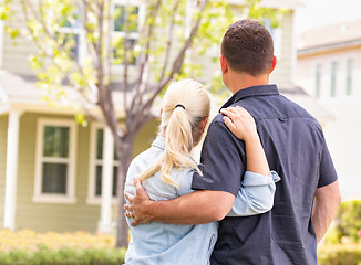 Image showing Happy Caucasian Couple Facing Front of House