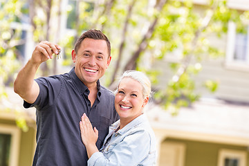 Image showing Caucasian Couple in Front of House with Keys