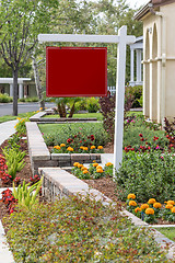 Image showing Blank Sale Real Estate Sign in Front of House