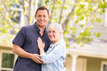 Image showing Happy Caucasian Couple in Front of House