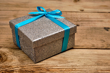 Image showing Gift box with blue ribbon