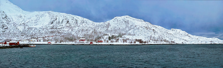 Image showing Norwegian fjord with red rorbu houses in Norway in winter