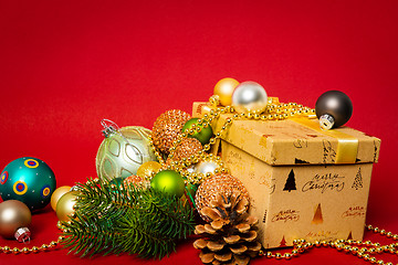 Image showing Christmas decoration gift box with red background