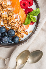 Image showing Yogurt with baked granola and berries