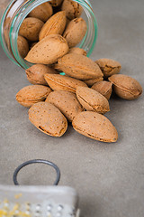 Image showing Glass jar with almonds