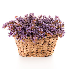 Image showing Basket with purple flowers
