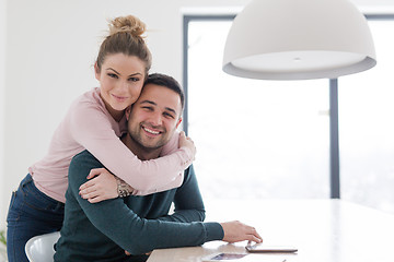 Image showing couple hugging in their new home