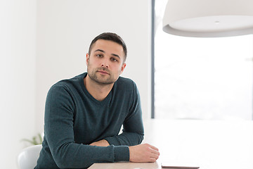 Image showing Young casual businessman using smartphone