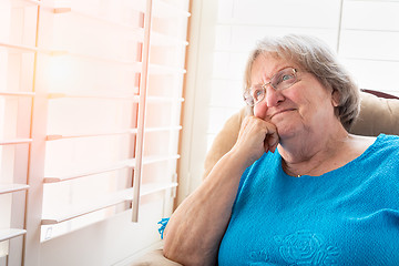 Image showing Content Senior Woman Gazing Out of Her Window