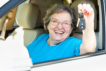 Image showing Happy Senior Woman Sitting In New Car Holding The Keys