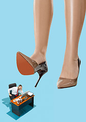 Image showing The conceptual collage about lady boss and small man under big female heel.