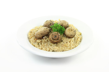 Image showing Fried white mushrooms on rice. 