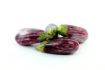 Image showing Pile Graffiti Baby Eggplants on white. 