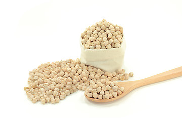 Image showing Chick Peas on pile, in wooden spoon, in fabric bag 