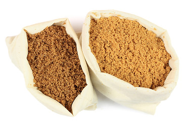 Image showing Two types brown sugar in white fabric bags. 