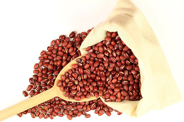 Image showing Organic Azuki Beans in Fabric bag and wooden spoon. 