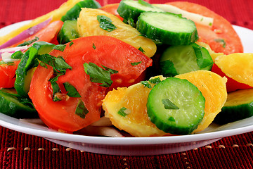 Image showing Close-up view of mixed fruits and vegetables salad. 