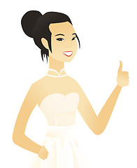 Image showing Young asian fiancee giving thumb up.